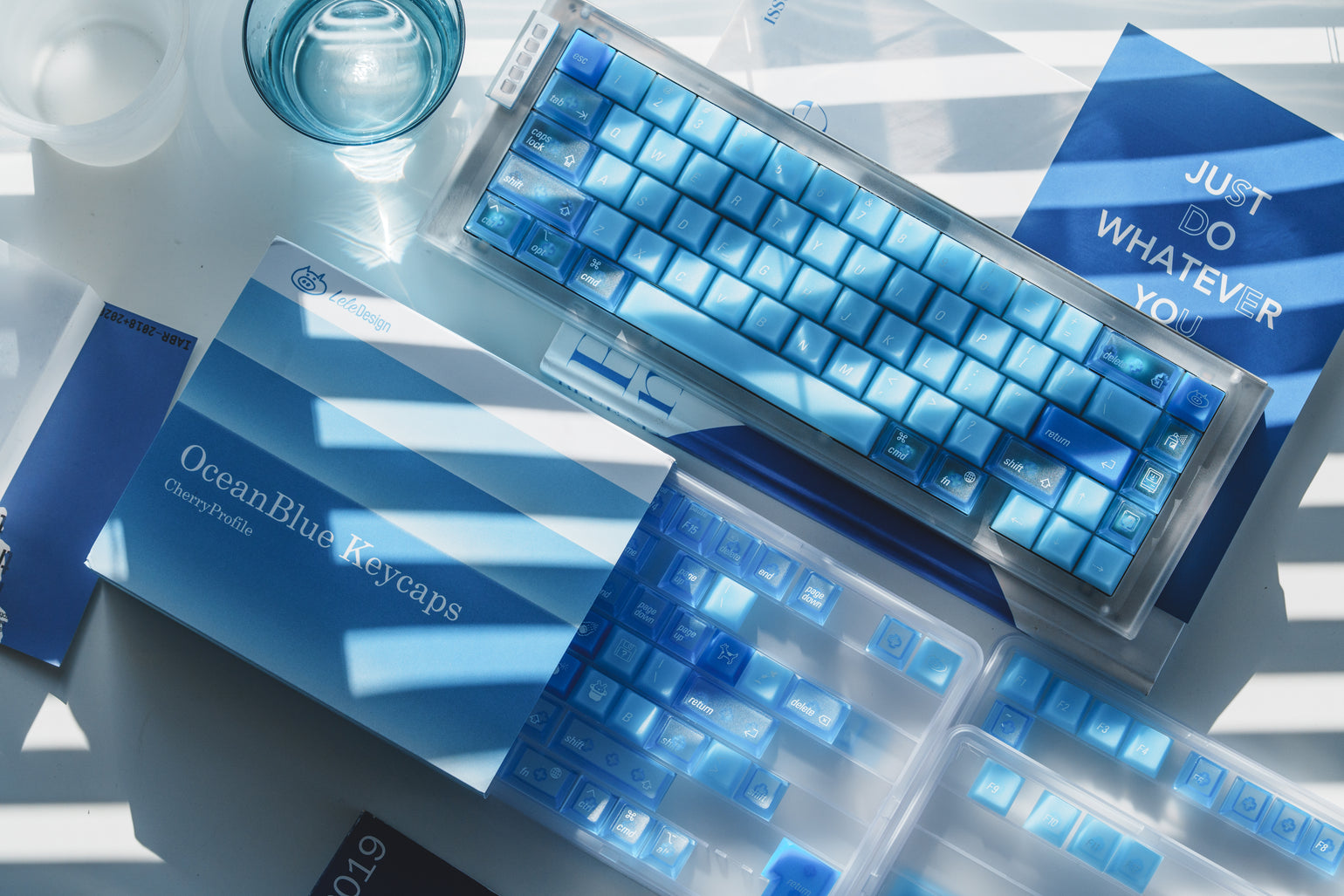 Ocean Blue keycaps in natural light with matching blue packaging