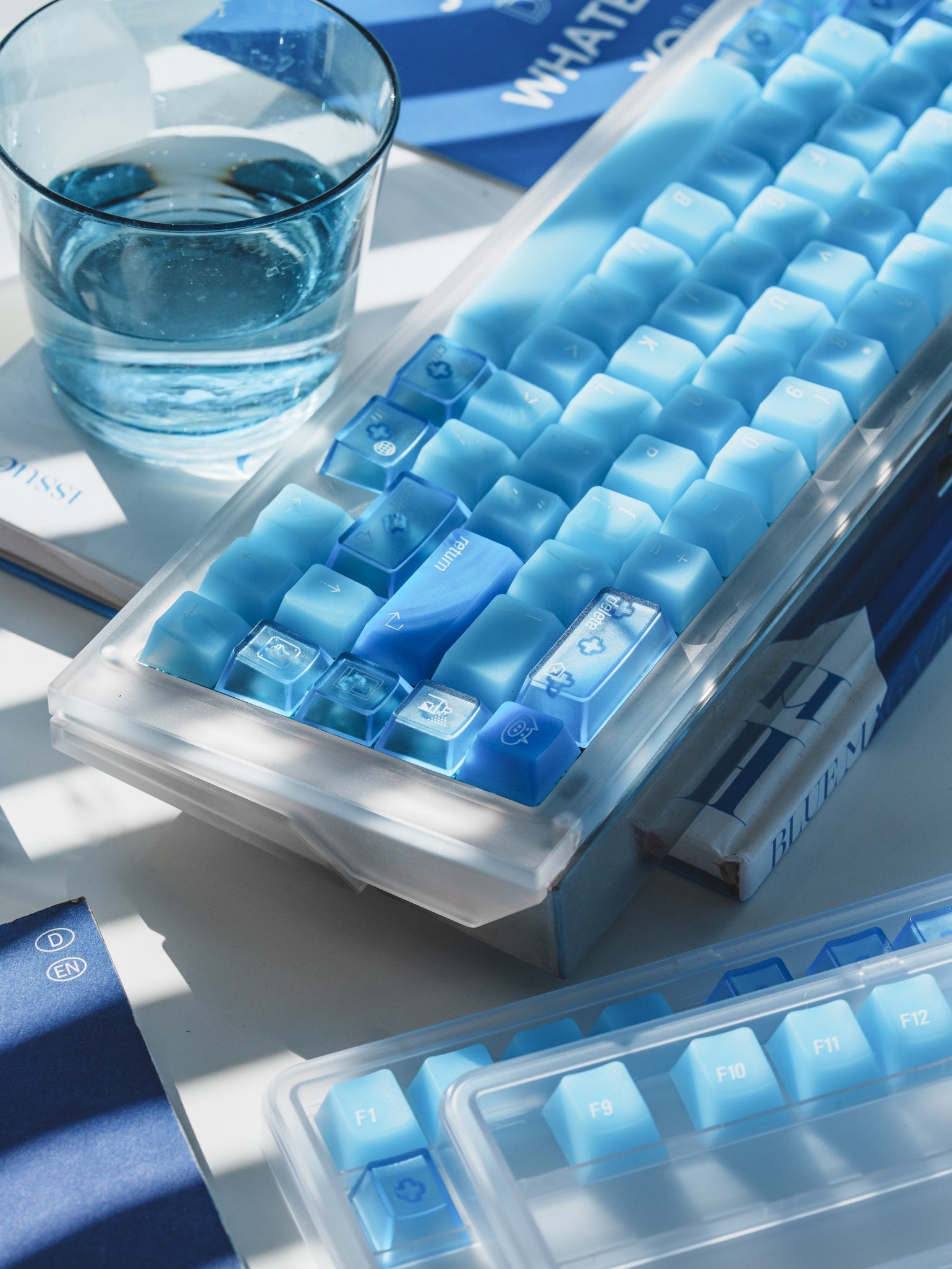 Close-up of blue polycarbonate keycaps and UV-printed legends